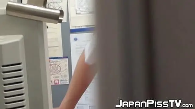 Japanese girls urinate in a bathroom with a close-up camera