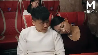 Asian MILF with big tits gives a blowjob in a public bus